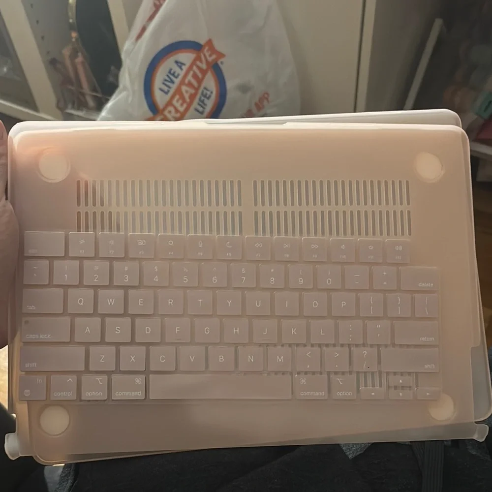 Apple Laptop with Pink Cover